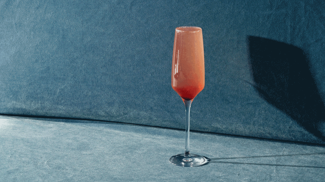 Animated Symphony 6 cocktail being poured into a champagne flute