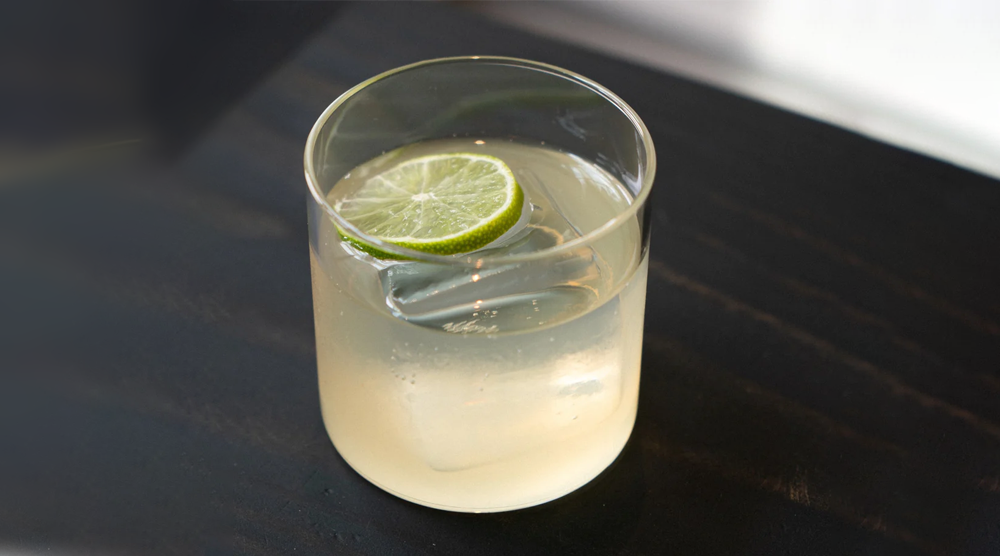 Ayuuk Mule cocktail in a rocks glass with lime wheel