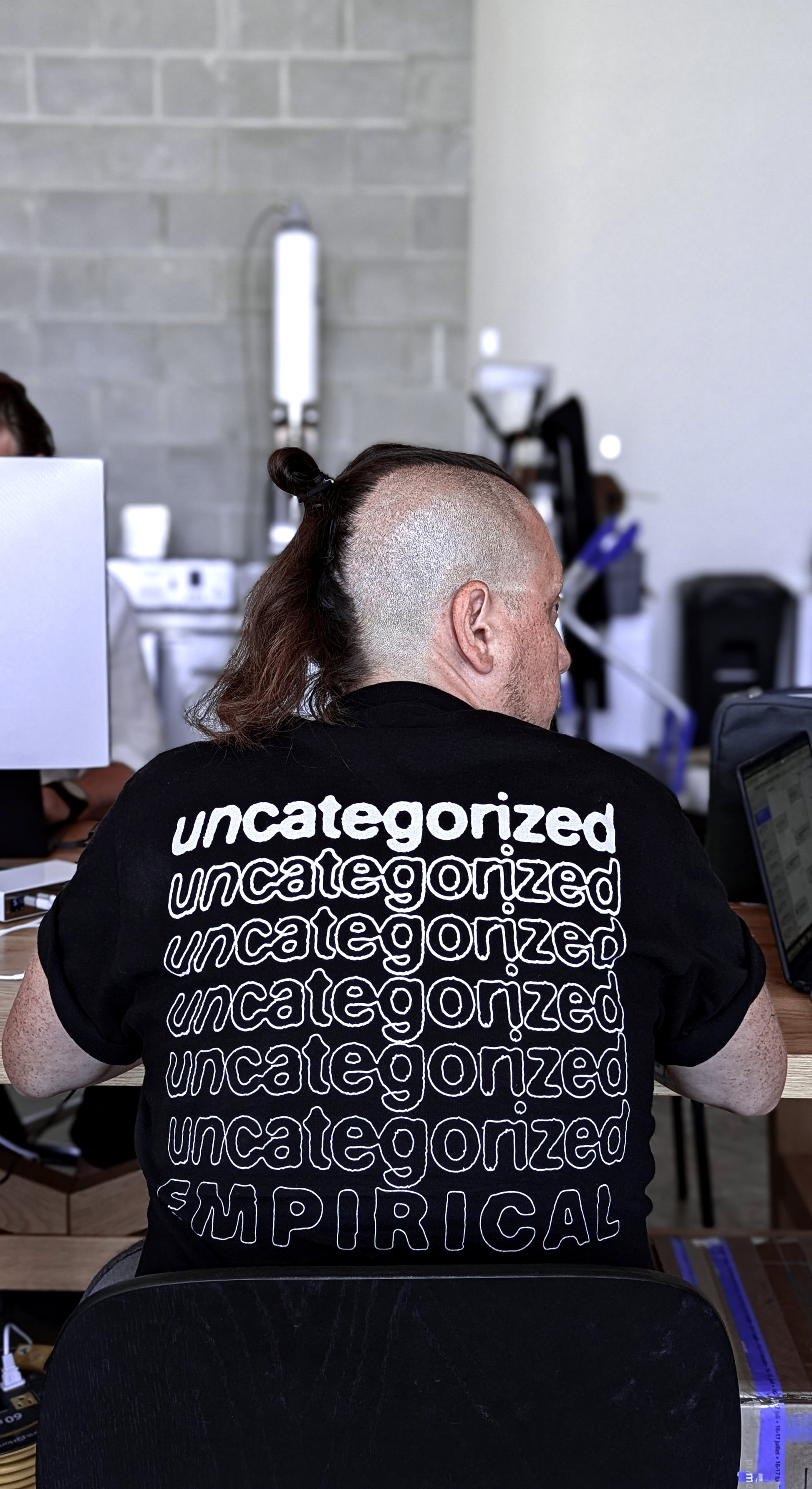 Empirical Uncategorized Tee being worn at the production studio