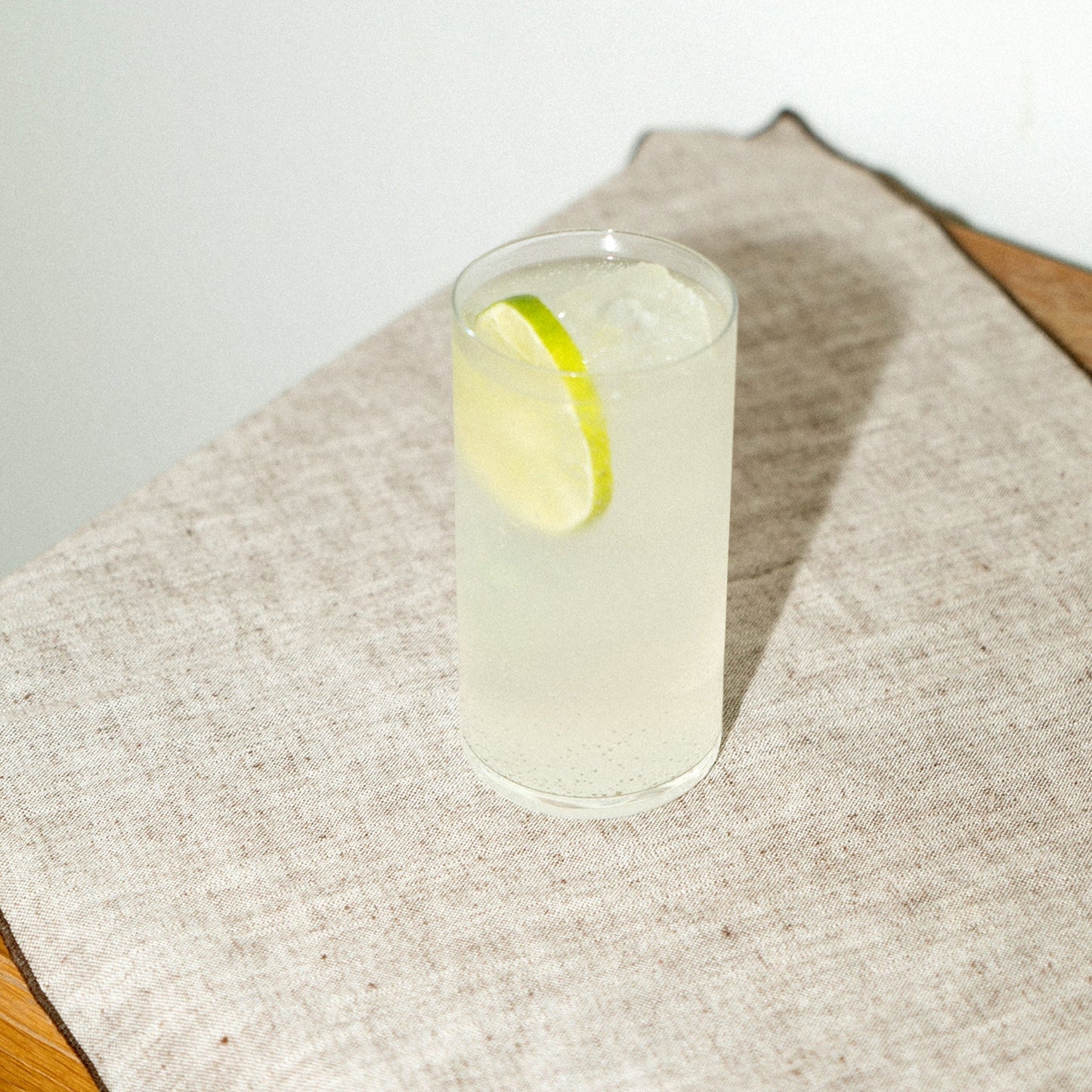 Empirical Ayuuk Mule cocktail in a rocks glass with lime wheel — holiday hero shot