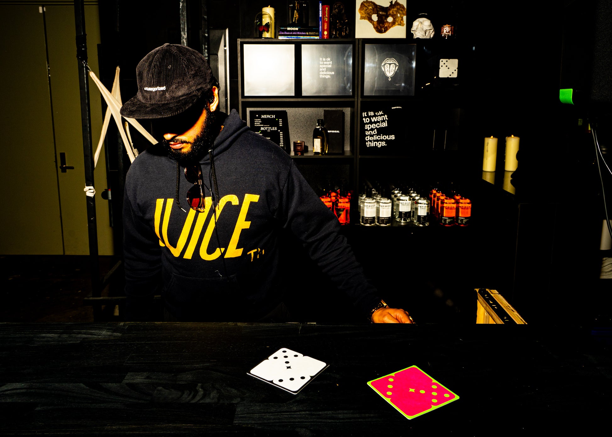 Empirical staffer in the cord cap behind the bar at the 53AD opening