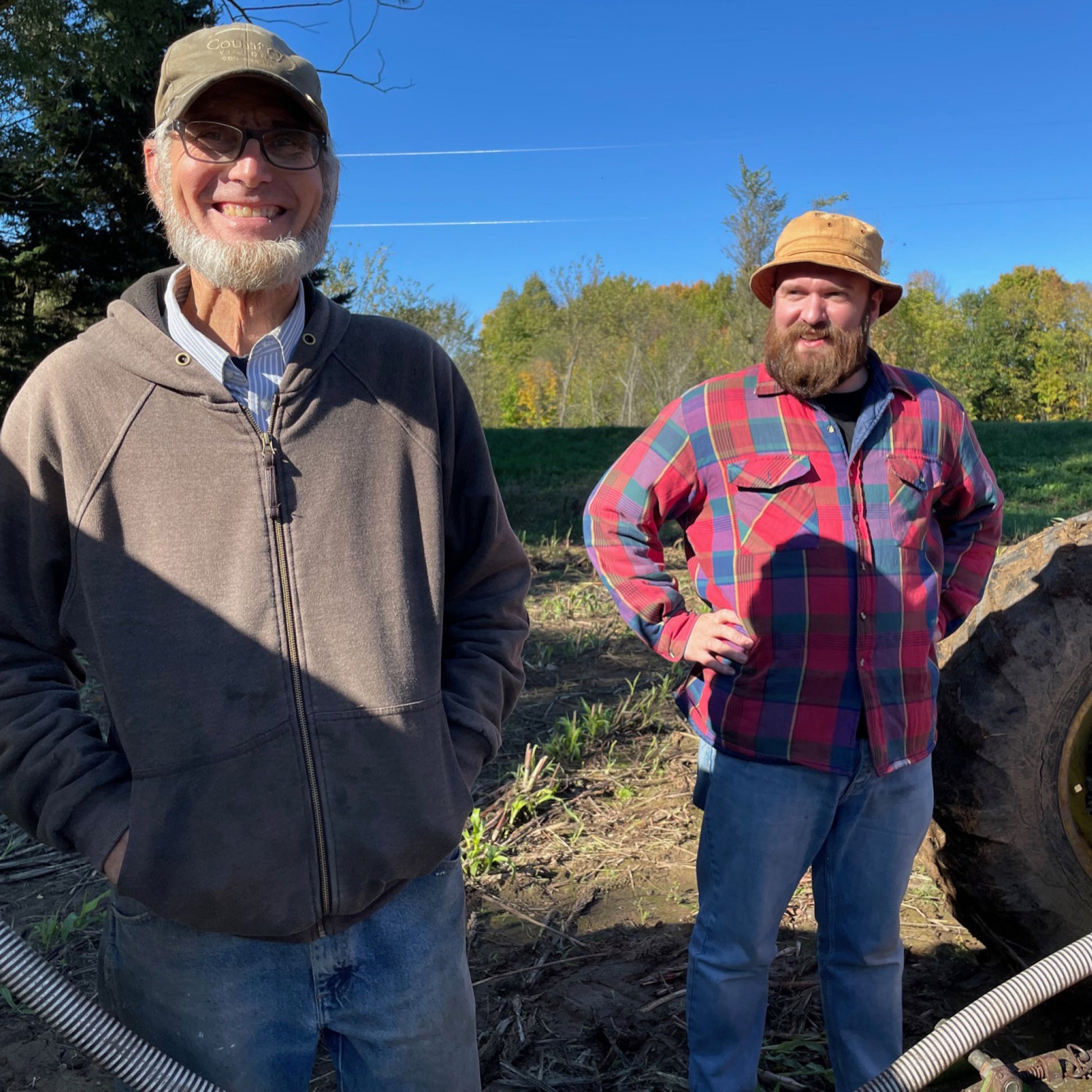 Two sorghum farmers standing in a Wisconsin field, source of Soka
